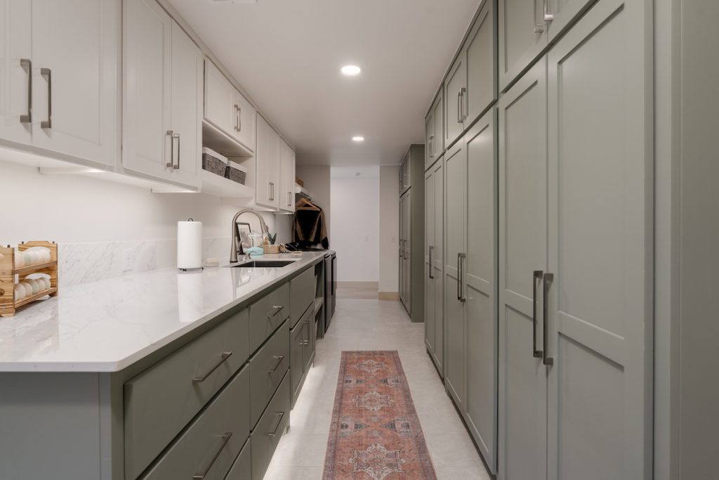 Light-filled living room with relocated fireplace and layered lighting