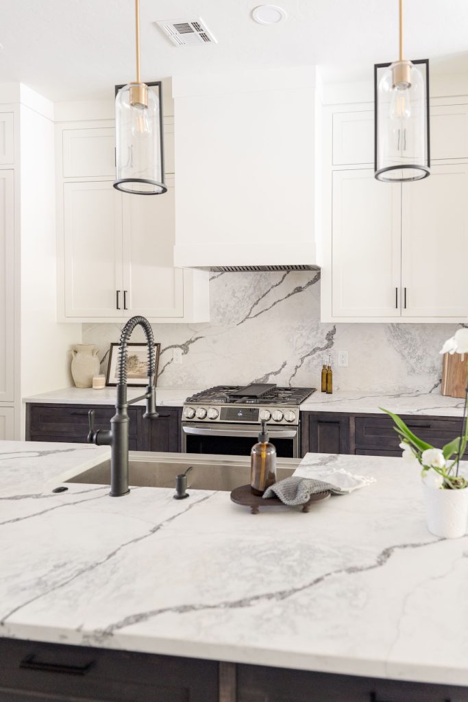 Two-tone kitchen cabinets with Dover White uppers and Carbon stained lowers